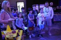 Bot museum visitors, with Panic Attack in foreground